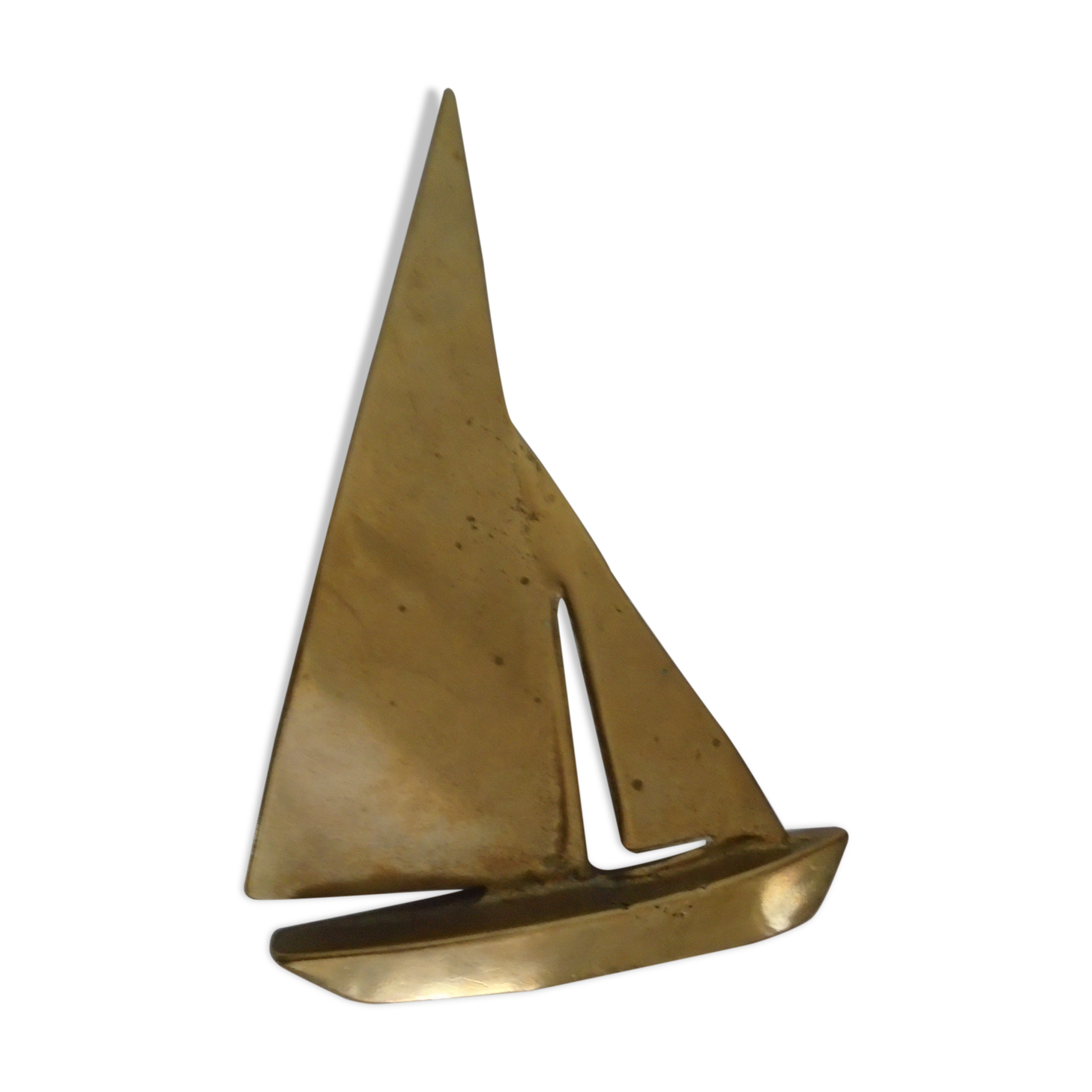 Stylized boat in brass decoration seaside