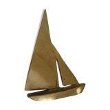 Stylized boat in brass decoration seaside