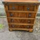 Small English chest of drawers with a folding top.