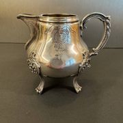 Antique silver-plated metal milk jug – Rococo style, chased decoration, early