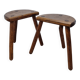 Pair of rustic tripod stools in solid wood, brutalist style.