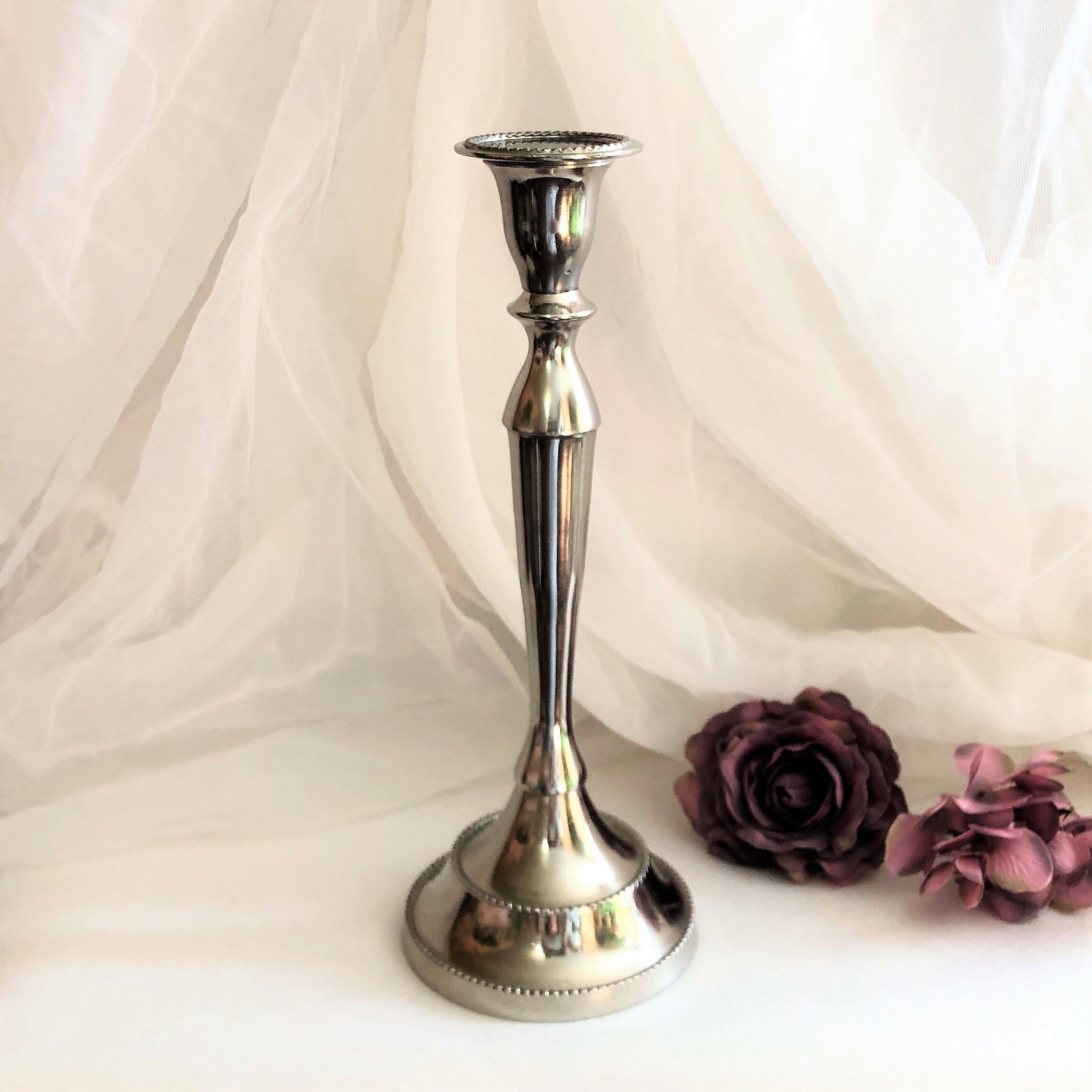 Chromed metal candle holder