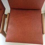 Red vintage chairs and compass feet
