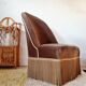 Brown velvet crapaud armchair with fringes and sculpted legs.