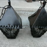 pair of wrought iron lanterns and granite glass