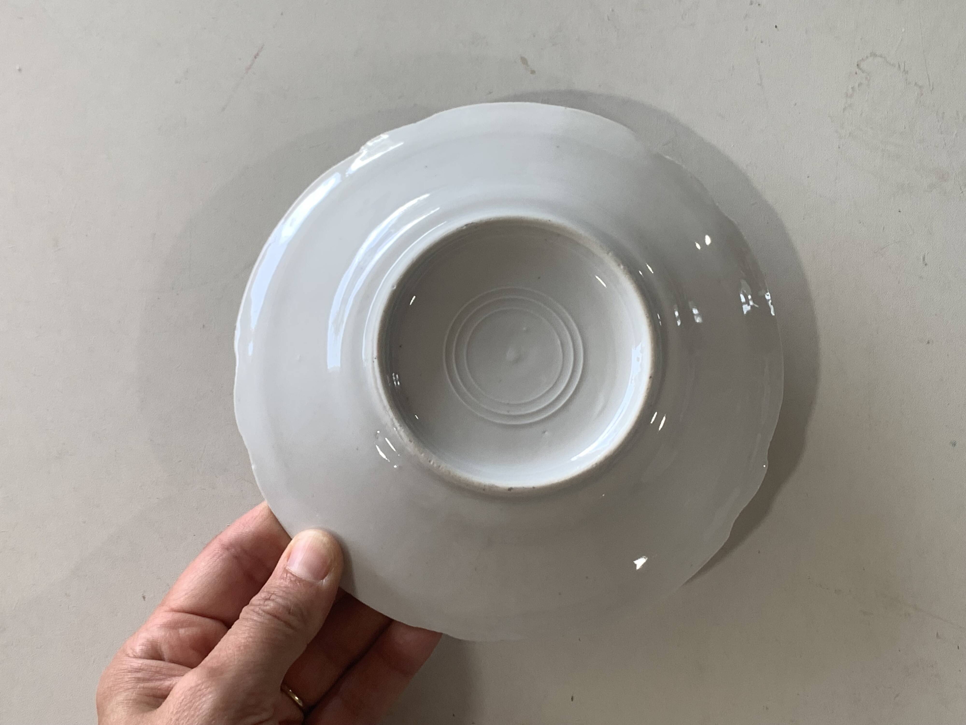 4 vintage porcelain saucers