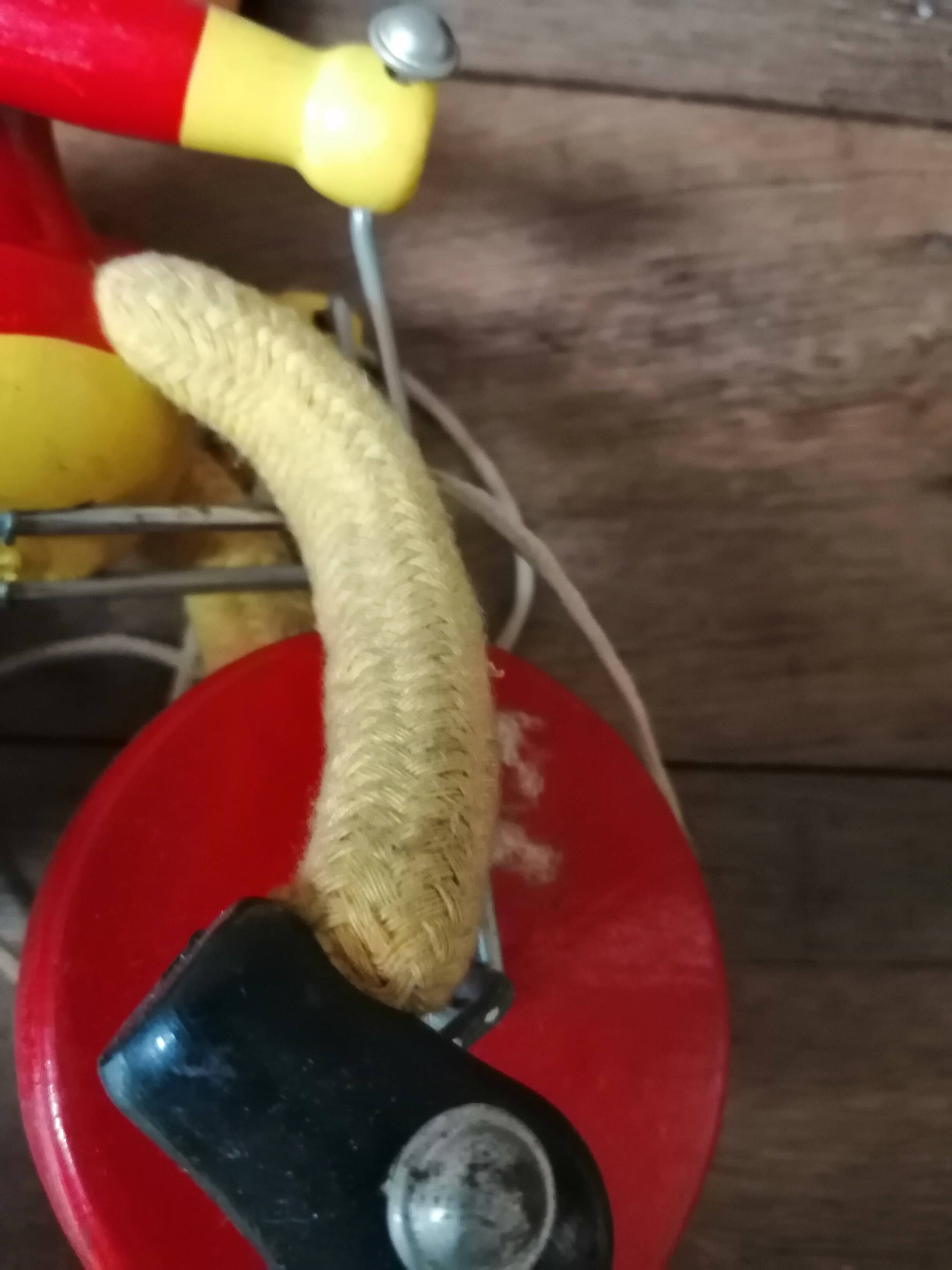 Old Mickey Mouse toy on his wooden tricycle
