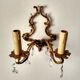 Rococo-style wall lamp in gilded bronze and crystal stamps