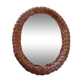 Oval mirror in dark rattan