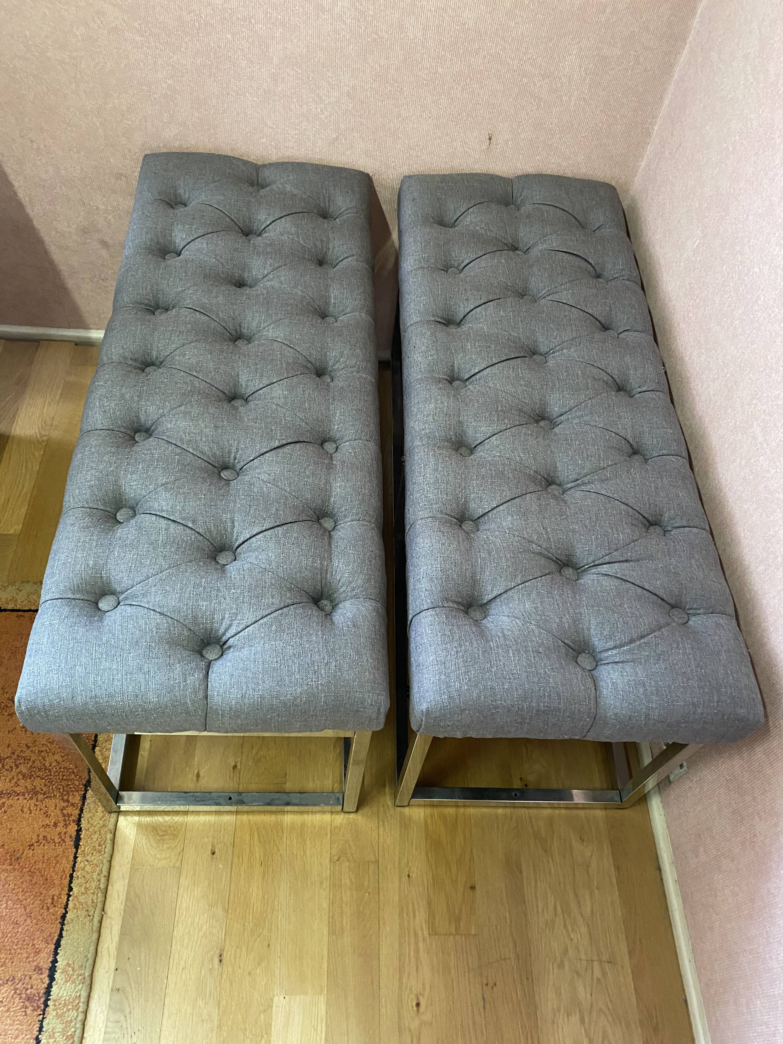 Pair of benches in chrome metal and padded gray fabric