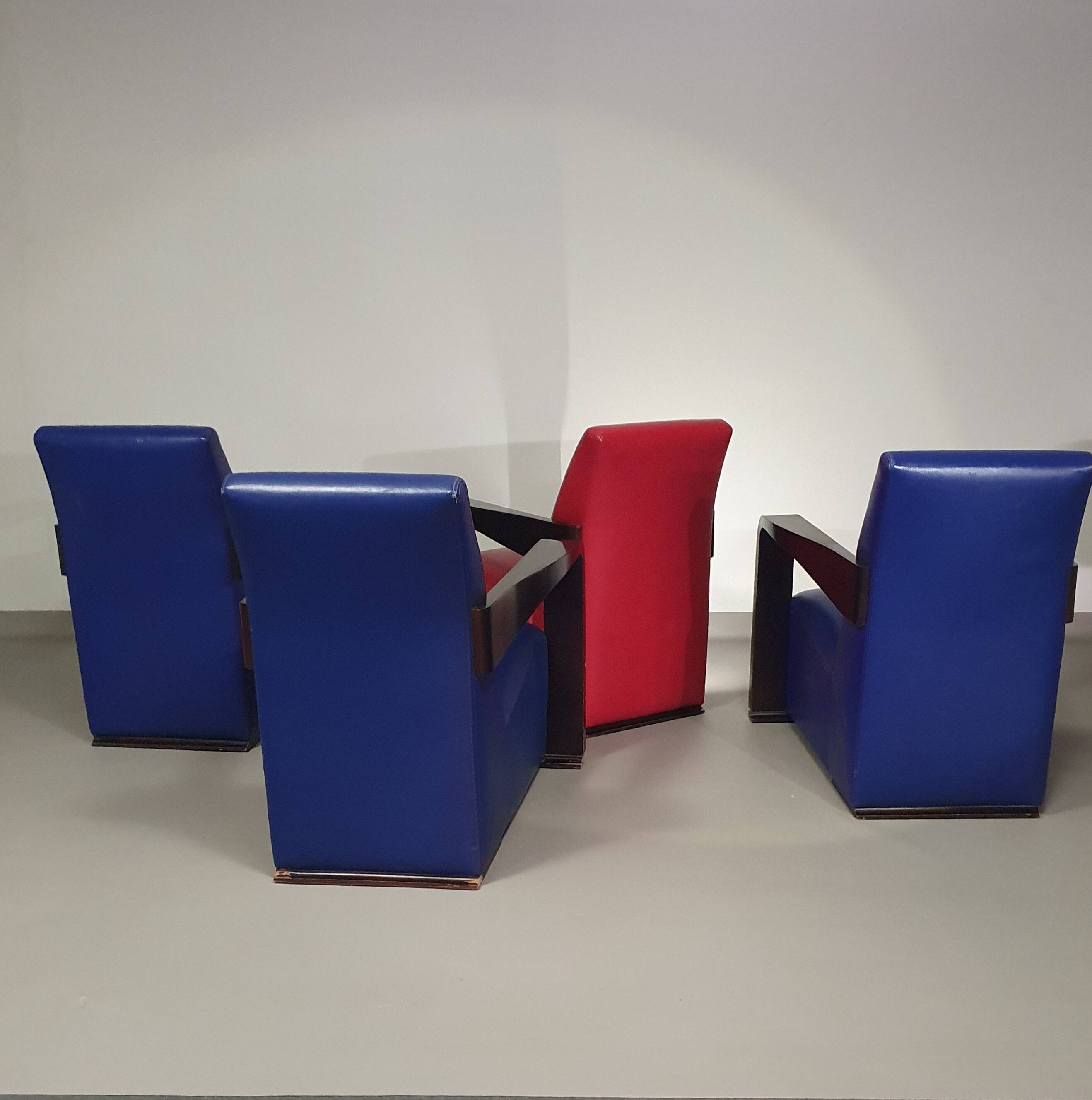 4 x Vintage Ying lounge chairs / fauteuils van Hugues Chevalier,'90. 3 x blue / 1 x red leather