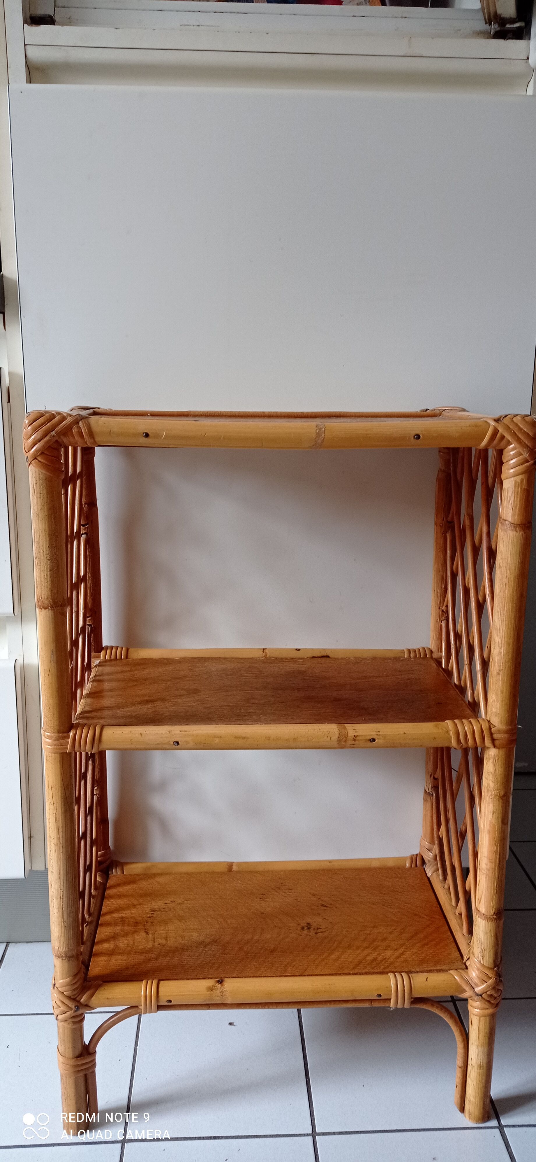 Old shelf on vintage rattan stands