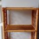 Old shelf on vintage rattan stands