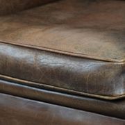 Vintage sheepskin armchair with warm colours and a characterful appearance
