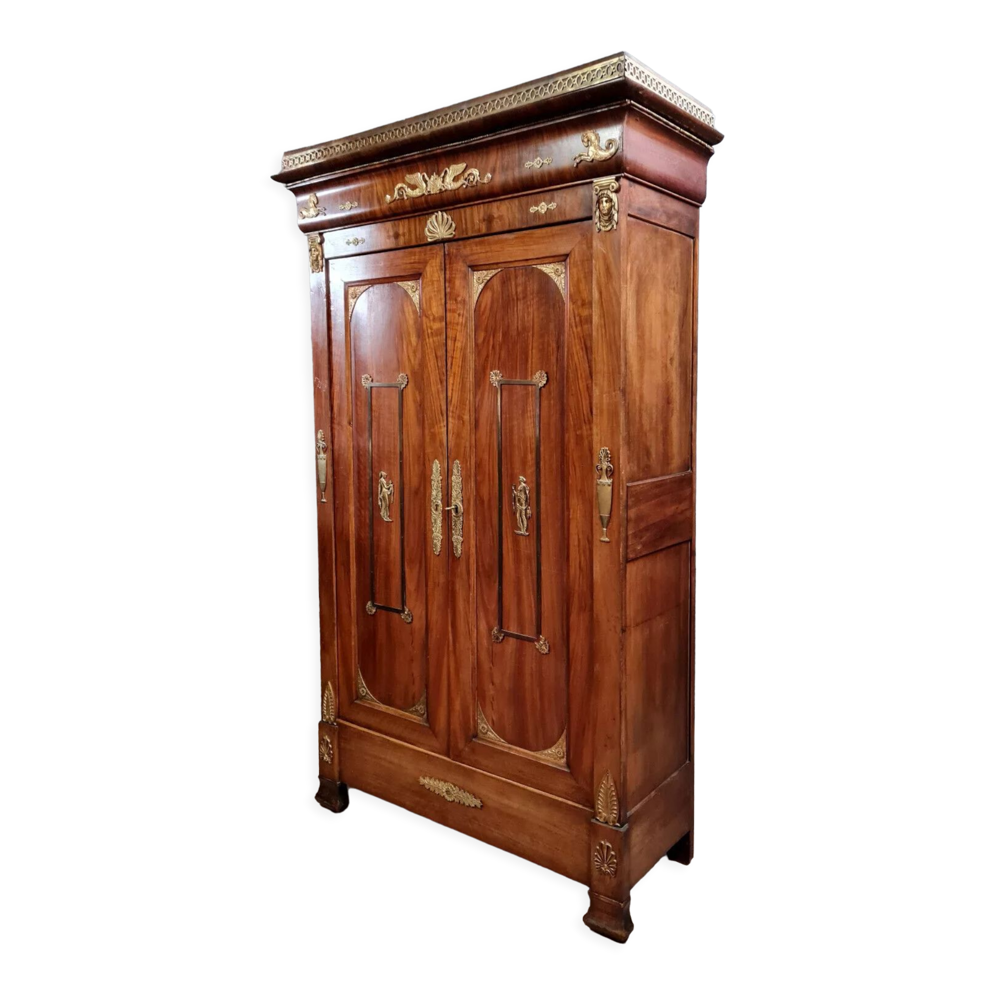 Louis Philippe period wardrobe (nineteenth) entirely covered with gilded bronzes