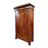 Louis Philippe period wardrobe (nineteenth) entirely covered with gilded bronzes