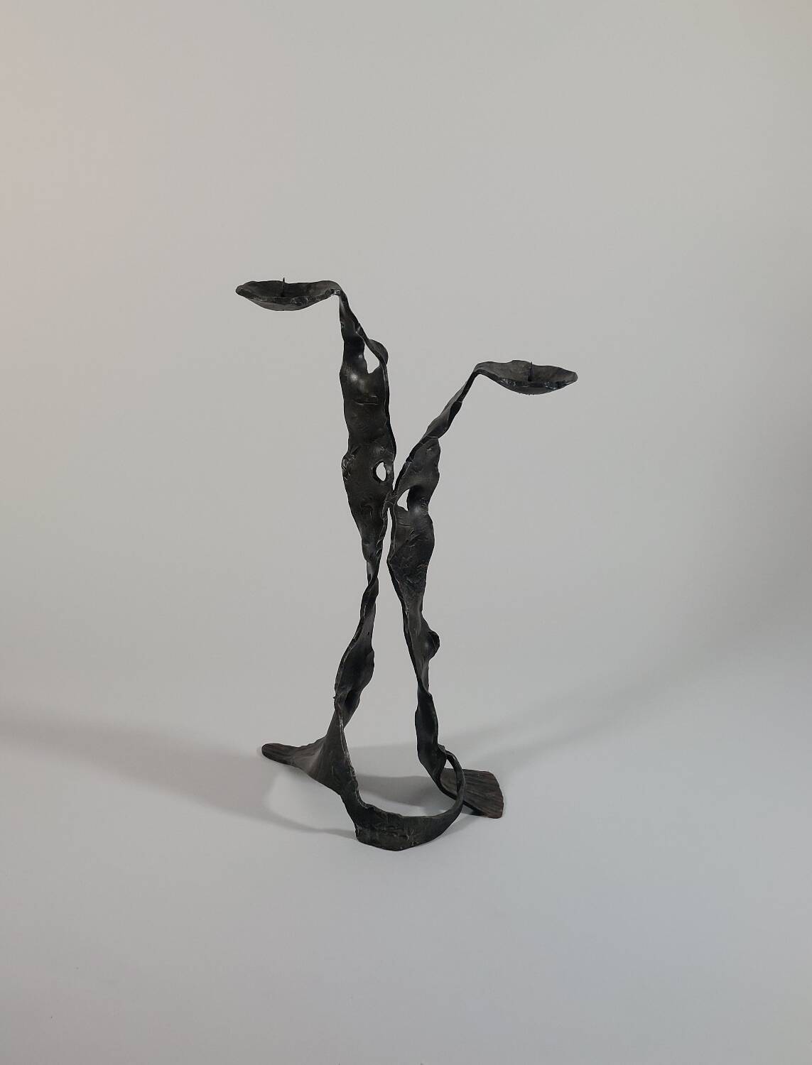 Sculptural brutalist floor candle holder made of hand-forged iron from the 1950s.