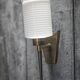 Brass wall light, black lacquered metal and white opal glass, 50s.