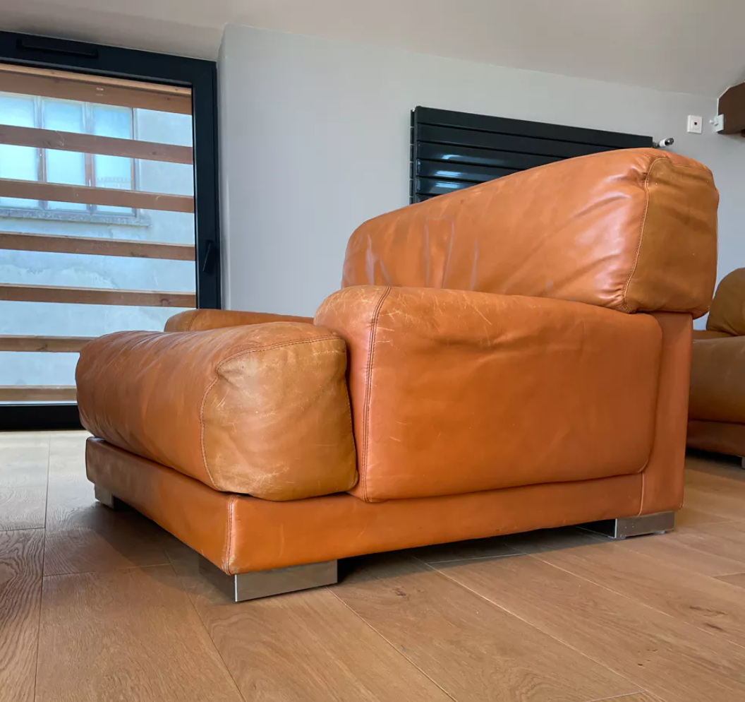 Pair of vintage armchairs Gérard Guermonprez tawny leather and stainless steel, France 1970