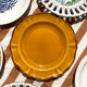 Set of twelve mismatched vintage dessert plates.