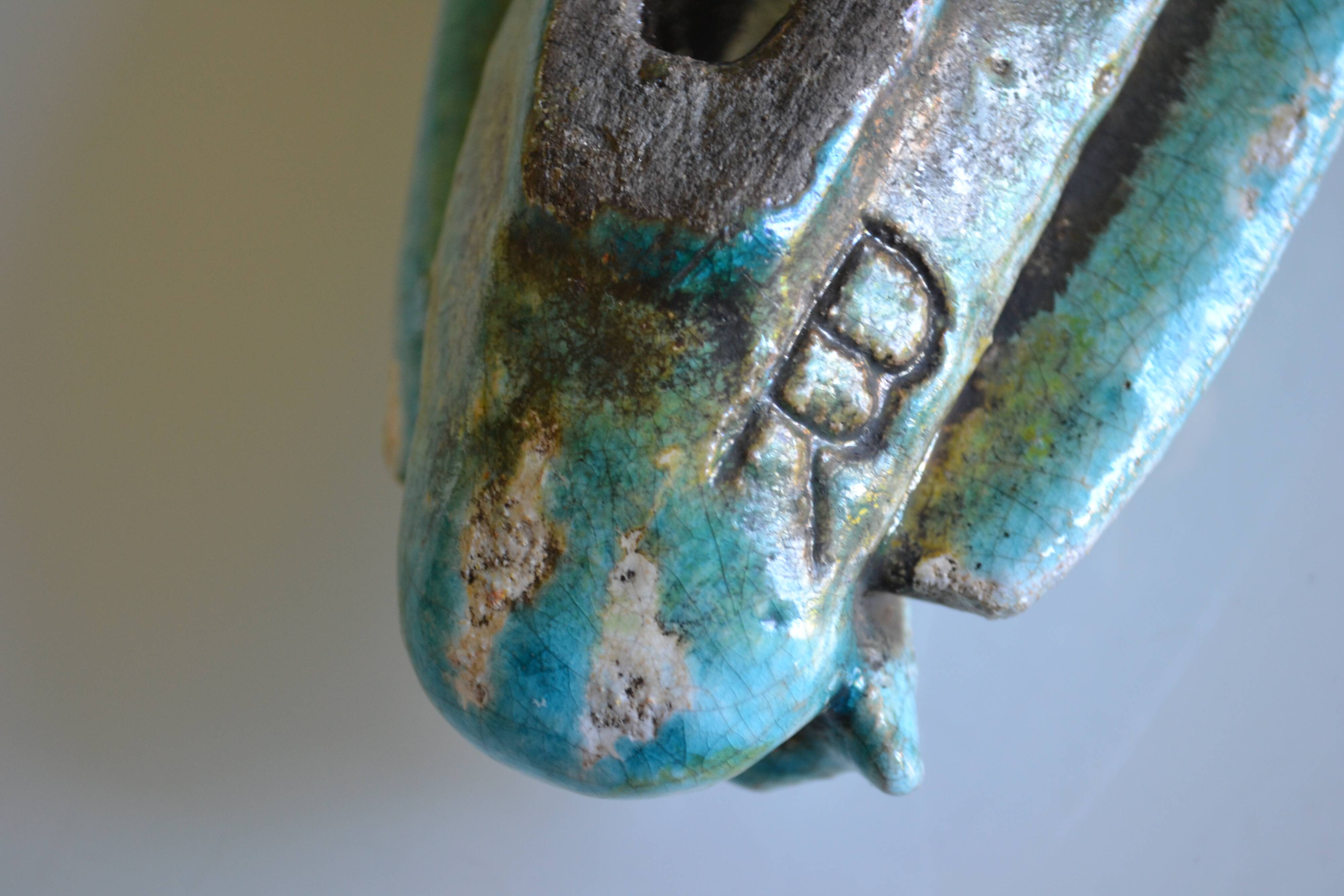 Surreal ceramic sculpture in relief signed to be identified.