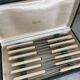 12 knives in white Bakelite, 1960