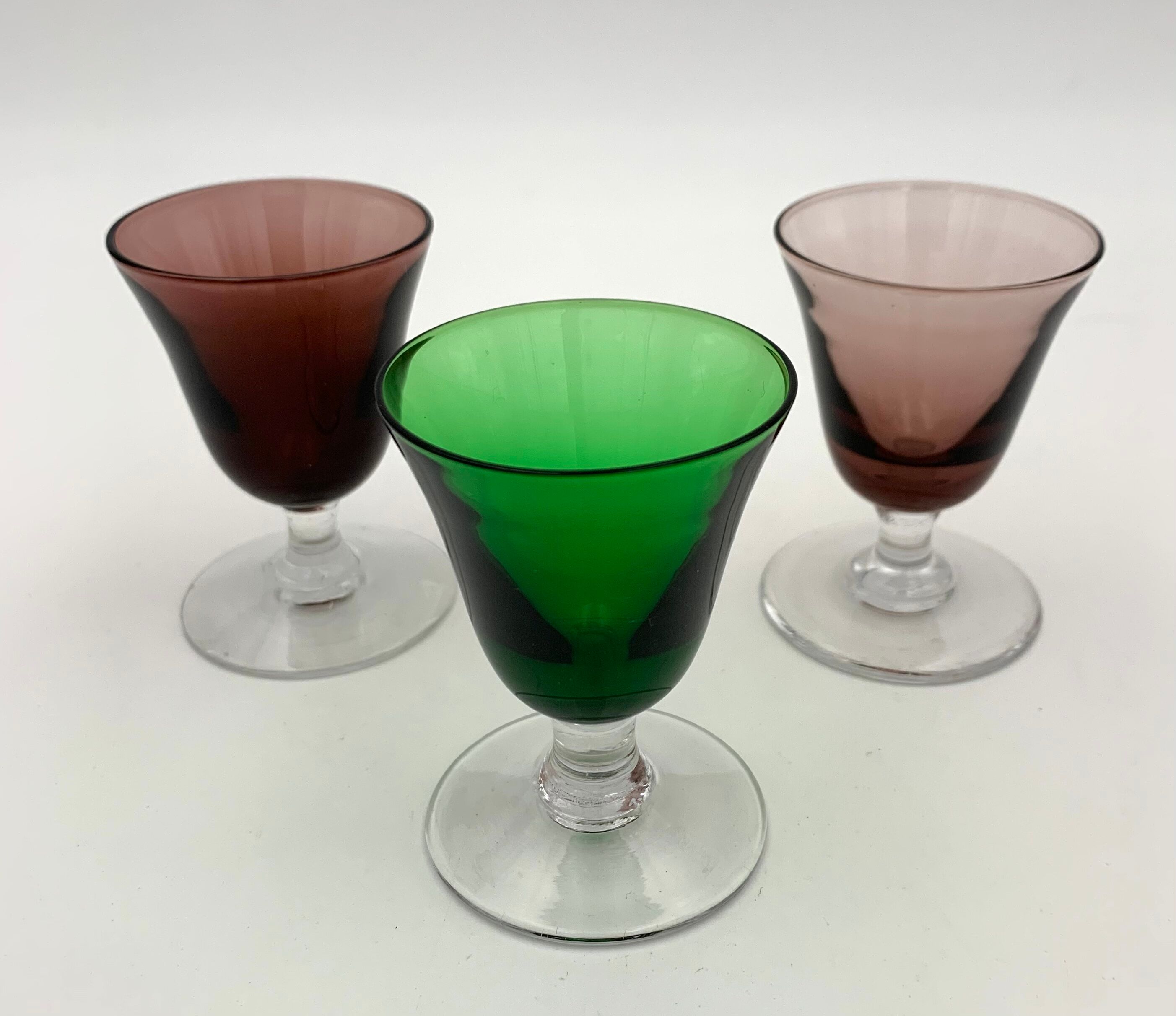 Nine vintage liquor glasses, coloured glass 20th century