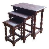 Nesting tables in oak wood. Turned wooden legs.