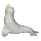 White earthenware sea lion in piggy bank