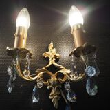 Pair of gilded bronze sconces and crystal pendants