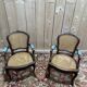 Paire de fauteuils de style Louis XV en cannage