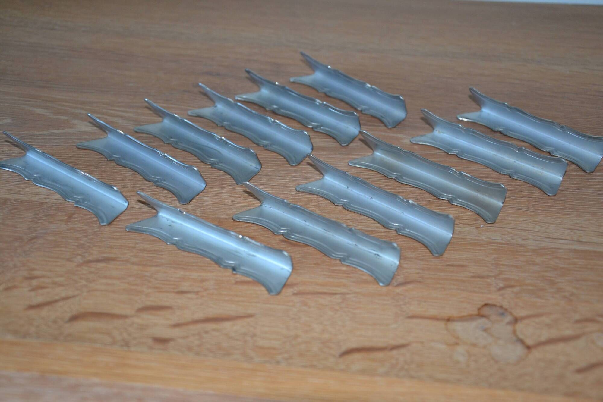 12 silver-plated knife rests