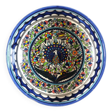 Large decorative dish with colorful peacock