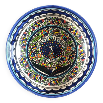 Large decorative dish with colorful peacock