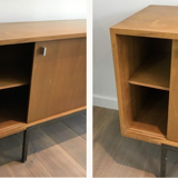 Row with double sliding doors and bar on metal base