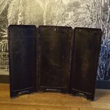 Old fireplace screen in painted sheet metal