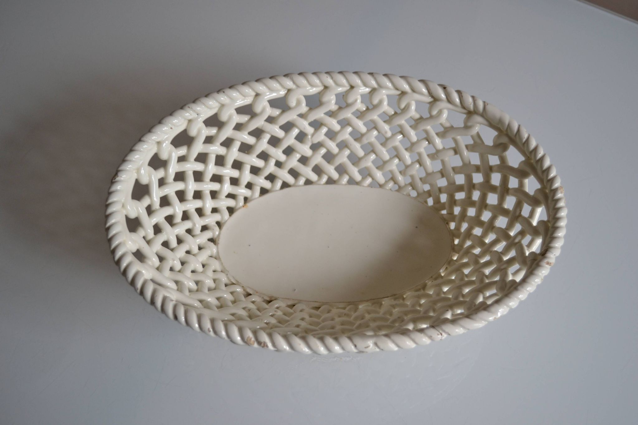 Woven ceramic oval fruit bowl or dish