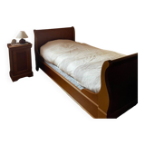 Bed with cherry wood base and bedside table
