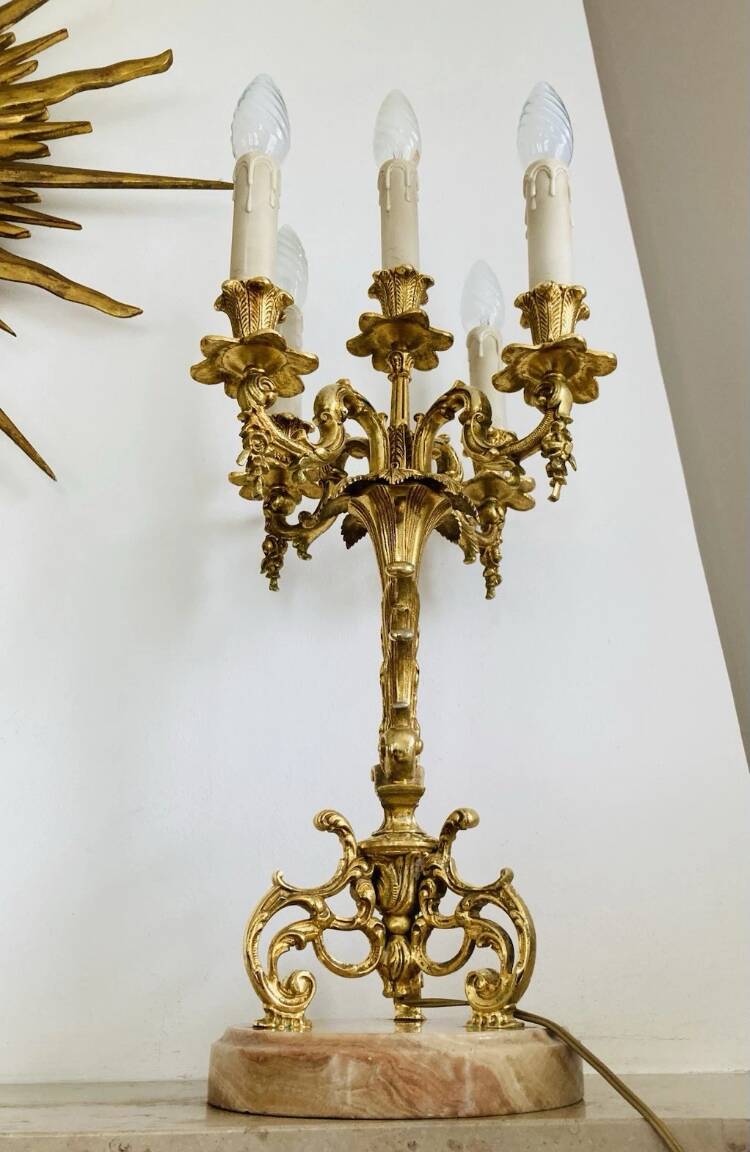 Pair of gilt bronze chandeliers, marble bases.