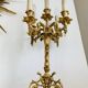 Pair of gilt bronze chandeliers, marble bases.