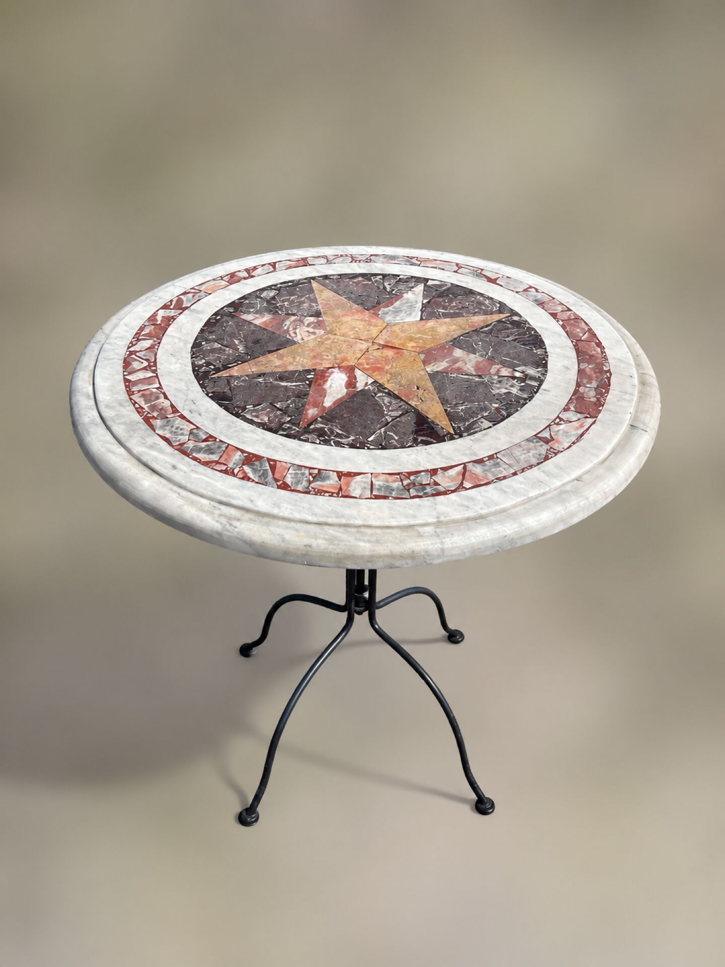 Round marble table with marble inlay