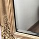 Richly carved antique gilded mirror