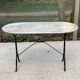 Table de bistrot marbre ovale et acier noir 4 couverts 120cm
