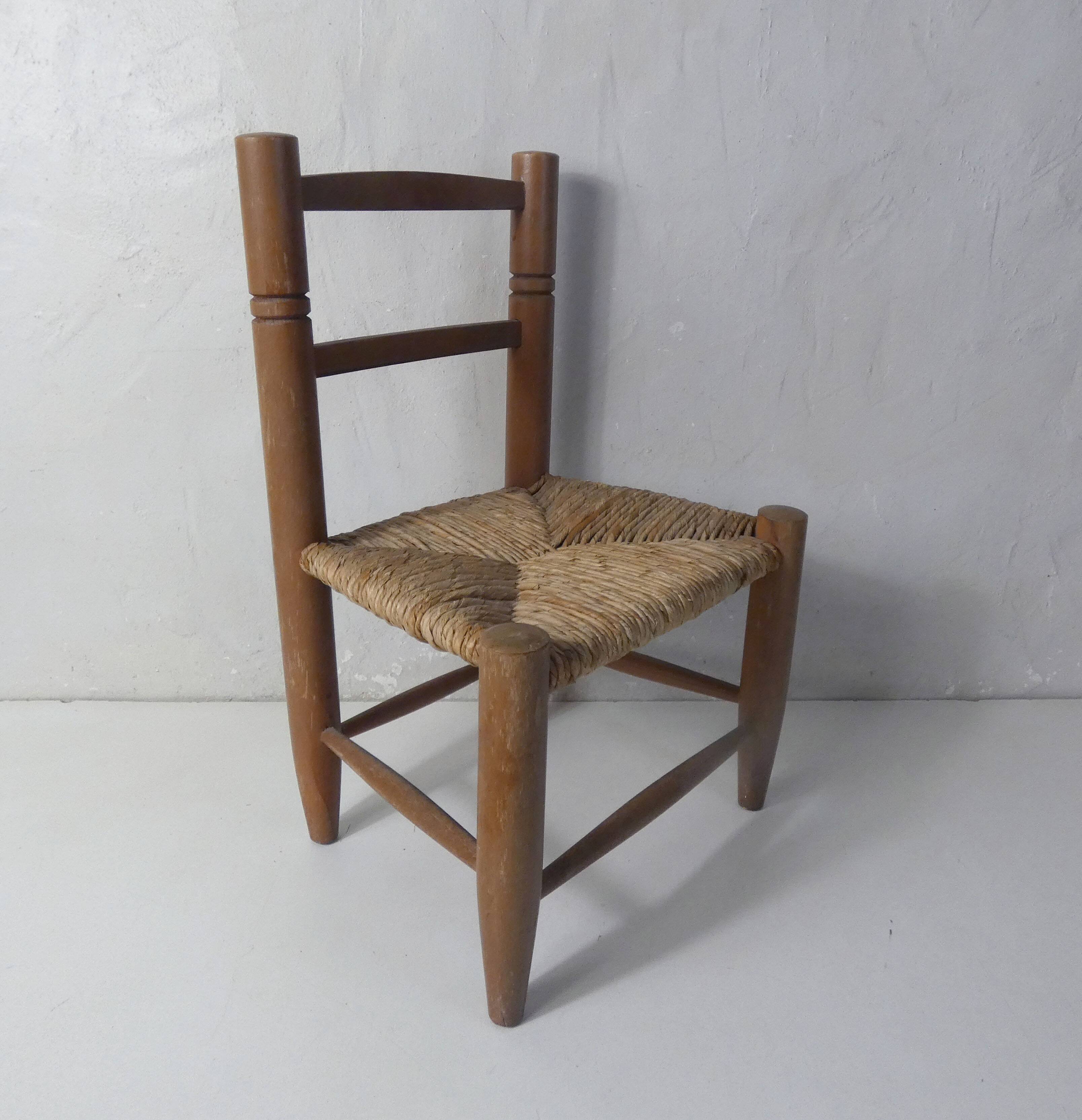 Old wooden straw chair for children