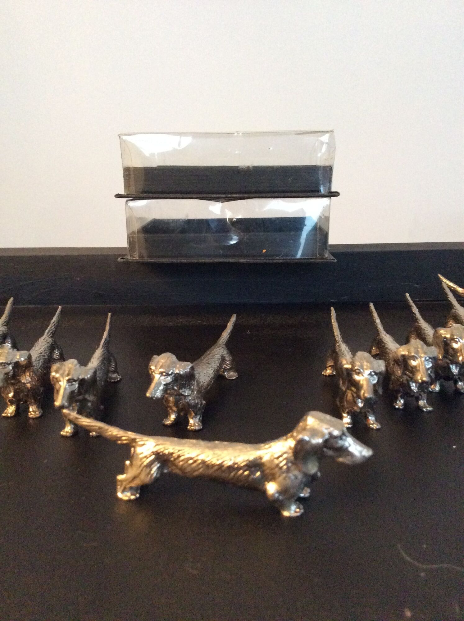 Series of 12 vintage dachshund knife holders in silver metal