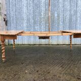 Round table in solid cherry wood, extendable with twisted legs, Louis Philippe style.