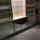Ivory-colored and matte gold anodized aluminum display bookcase