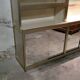 Ivory-colored and matte gold anodized aluminum display bookcase