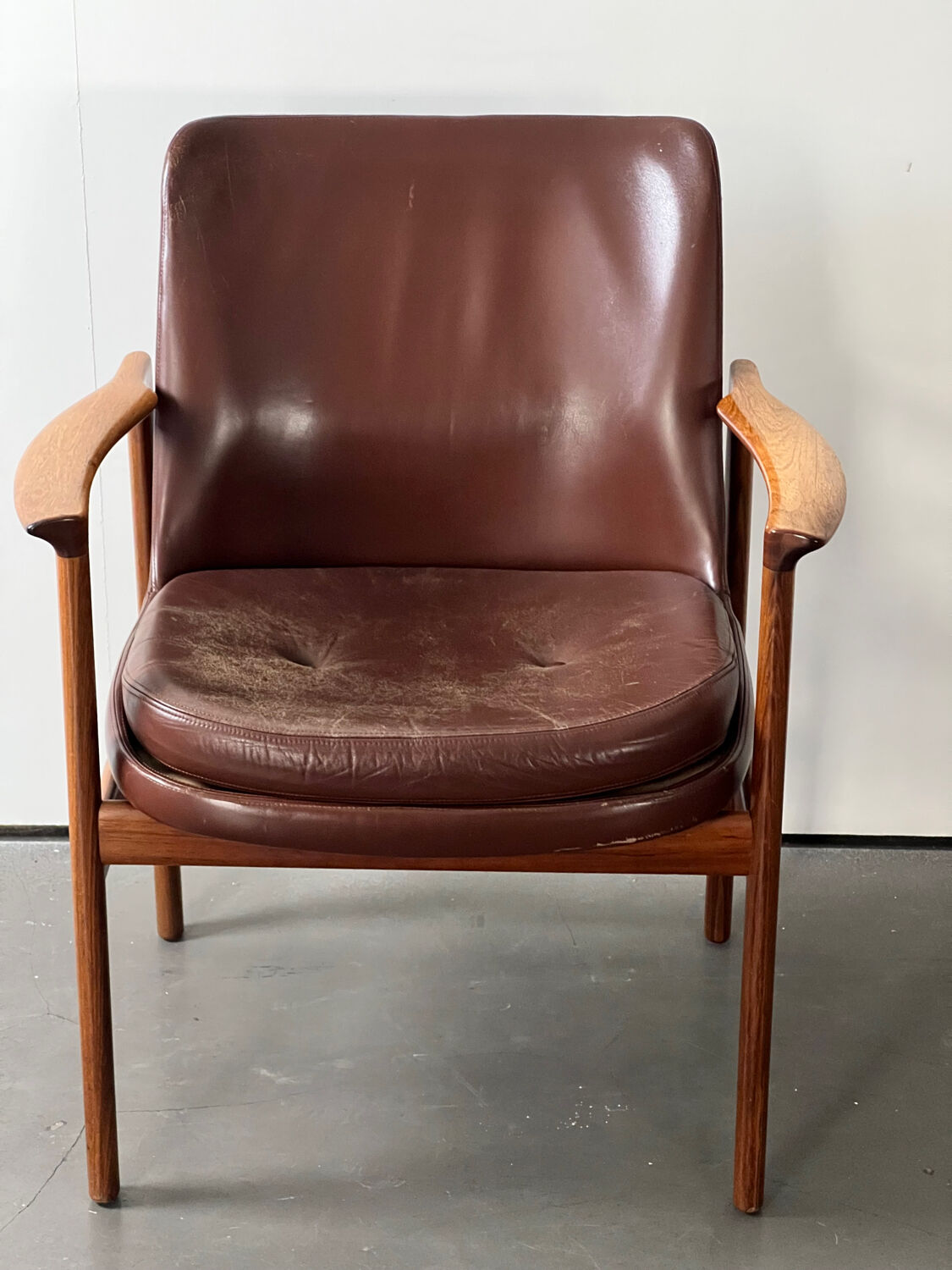 Leather and wood armchair by Ib Kofod Larsen
