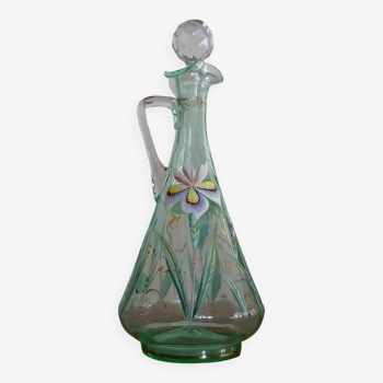 Old carafe enamelled with glass flowers